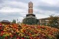 30 September 2018, Clock tower with flower garden colorful in chocolate factory Royalty Free Stock Photo