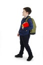 1-september concept. Back to school. Teenage boy with backpack on shoulders and books in hand.