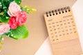 September 2024 Desk Calendar and flower on brown