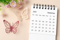 The September 2023 desk calendar for the organizer to plan, reminder and butterfly paer with flower on yellow background Royalty Free Stock Photo