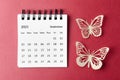 A September 2023 desk calendar for the organizer to plan and reminder with paer butterfly on red background