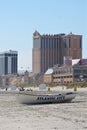 Small boat on dry beach sand at Atlantic City, New Jersey