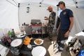 DUBIOUS WYOMING: Two hunters in camp making breakfast in a tent Royalty Free Stock Photo