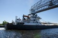 DULUTH, MN: Shipping barge boat passes under aerial lift bridge during summer