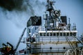 DULUTH, MN: Shipping barge boat heads out of Lake Superior in Minnesota, blowing coal smoke into the air Royalty Free Stock Photo