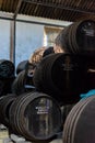 September 3, 2019, El Puerto de Santa Maria, Andalusia, Spain, old bodega with dark wooden barrels with sherry wine Royalty Free Stock Photo