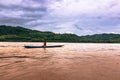 September 21, 2014: Fisherman in the Mekong river, Laos Royalty Free Stock Photo