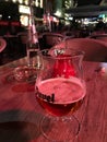 Half glass of Duvel beer at outdoor table of cafe in Antwerp, Be Royalty Free Stock Photo