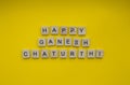 happy Ganesh Chaturthi, a minimalistic banner with an inscription in wooden letters Royalty Free Stock Photo