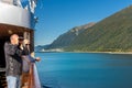September 14, 2018 - Juneau, AK: Ship passenger with binoculars viewing scenery.
