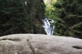 September in Karkonosze, waterfall on a mountain river in forest