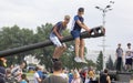 September 9, 2018 Minsk, Belarus. Victory Park. Two teenagers sit on the muzzle of a tank during