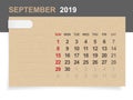 September 2019 - Monthly calendar on brown paper and wood background with area for note. Royalty Free Stock Photo