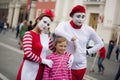 9 September 2014. Moscow, Russia. Two people with pantomime makeup and cheerful child. Moscow Day. Editorial documentary