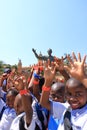 September 29 2022 - Pretoria, South Africa: Happy Children at the Nelson Mandela statue on his square in front of Union Buildings