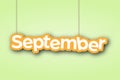 SEPTEMBER. A sign with the name of the month of the year hangs on the ropes