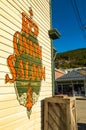 September 15, 2018 - Skagway, AK: Side view of The Red Onion Saloon and public cigarette disposal bin from 2nd Ave. Royalty Free Stock Photo