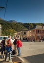 September 15, 2018 - Skagway, AK: Tourists at corner of Broadway and 2nd Ave., NPS Visitor Center in background. Royalty Free Stock Photo