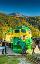 September 15, 2018 - Skagway, AK: Tourists walking in front of White Pass Railway train, Broadway Street crossing.