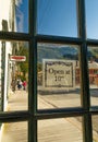 September 15, 2018 - Skagway, AK: View along 2nd Ave though open back door of The Red Onion Saloon. Royalty Free Stock Photo