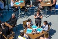 Working waitress at outdoor cafe Royalty Free Stock Photo