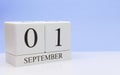 September 01st. Day 1 of month, daily calendar on white table with reflection, with light blue background. Autumn time, empty Royalty Free Stock Photo