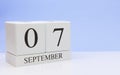September 07st. Day 7 of month, daily calendar on white table with reflection, with light blue background. Autumn time, empty Royalty Free Stock Photo