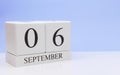 September 06st. Day 6 of month, daily calendar on white table with reflection, with light blue background. Autumn time, empty Royalty Free Stock Photo