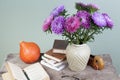 September 1 still life a bouquet of asters and books on the background of a school board