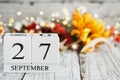 September 27th Calendar Blocks with Autumn Decorations Royalty Free Stock Photo