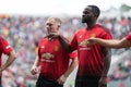 Paul Scholes and Louis Saha line up at Pairc Ui Chaoimh pitch before the start of the Liam Miller Tribute match