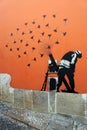 Lissabon Portugal: Cloves fired from mortar, mural, Banksy, Cloves Revolution 1974, Lisbon Portugal Royalty Free Stock Photo