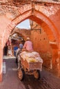 Horse and cart going through archway in the souk