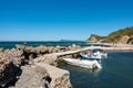 September 13th 2022 - Mathraki, Greece - Picturesque gulf with a small dock in Mathraki island, Grece