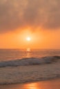 Sunset behind the Malibu Hills and the Pacific Ocean with Breaking waves