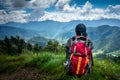 September 16th 2021 Uttarakhand INDIA. A solo hiker Hikers with a backpack looking towards the valley of Mountains. Nag Tibba trek
