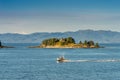 September 17, 2018 - Tongass Narrows, AK: Aluminum fishing boat near Guard Islands and lighthouse, early morning.