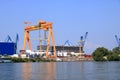 September 13 2021 - Tulcea in Romania: Industrial cargo port skyline, loading cranes in Tulcea on Danube river Royalty Free Stock Photo