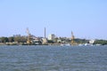 September 13 2021 - Tulcea in Romania: Industrial cargo port skyline, loading cranes in Tulcea on Danube river Royalty Free Stock Photo