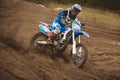 24 september 2016 - Volgsk, Russia, MX moto cross racing - Girl Bike Rider rides on a motorcycle and throwing a spray of