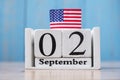 2 September of white Calendar with United States of America flag on wood background. copy space for text. Happy Labor day 2019 and Royalty Free Stock Photo