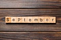 September word written on wood block. September text on wooden table for your desing, Top view concept Royalty Free Stock Photo