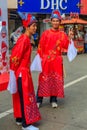 Unidentified people in traditional outfits a busy shopping stree