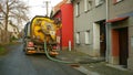 OLOMOUC, CZECH REPUBLIC, DECEMBER, 30, 2019: Septic cesspool emptying pumping into pipe tank truck suction hose under