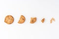 Sequence of chocolate chip cookies being devoured isolated on white background.