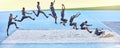 A sequence of a fit male athlete jumping in a sandpit competing in the long jump. Professional athlete or track racer Royalty Free Stock Photo