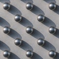 Minimalist Repetition of Metallic Spheres Forming Geometric Shadow Pattern Royalty Free Stock Photo