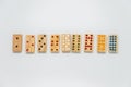 Sequence of wooden dominos on white background with selective focus Royalty Free Stock Photo