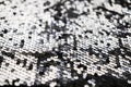 Sequin fabric texture. Shiny silver sparkling background. Clothing piece of glitter metallic for a glamorous party Royalty Free Stock Photo