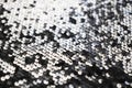 Sequin fabric texture. Shiny silver sparkling background. Clothing piece of glitter metallic for a glamorous party Royalty Free Stock Photo